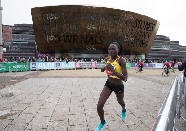 071018 - Cardiff University Cardiff Half Marathon - Womens race winner Uganda's Juliet Chekwel makes her way through Roald Dahl Plas and past the Wales Millennium Centre