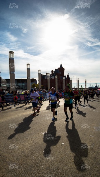 071018 - Cardiff University Cardiff Half Marathon - Runners make their way through Roald Dahl Plas and past the Wales Millennium Centre