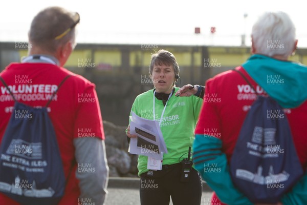 071018 - Cardiff Half Marathon - Race volunteers are briefed  at Cardiff Bay Barrage