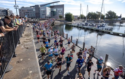 041026 Cardiff Half Marathon - Participants make their way through Cardiff Bay during the 2026 Cardiff Half Marathon