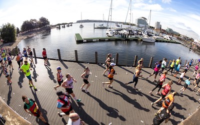 041026 Cardiff Half Marathon - Participants make their way through Cardiff Bay during the 2026 Cardiff Half Marathon