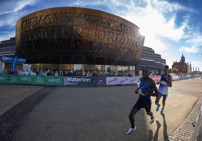 041026 Cardiff Half Marathon - Eventual Winner Gideon Kiprotich make his way through Cardiff Bay past the Millennium Centre during the 2026 Cardiff Half Marathon