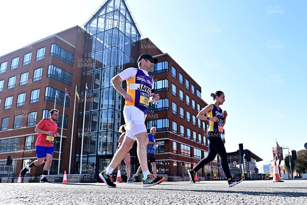 270322 - Cardiff University Cardiff Half Marathon - Runners pass Ty Hywel