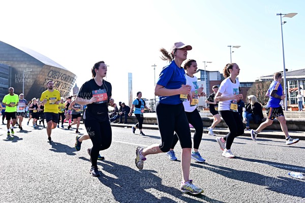 270322 - Cardiff University Cardiff Half Marathon - Runners pass Wales Millennium Centre