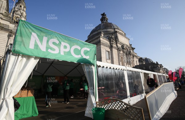 270322 - Cardiff University Cardiff Half Marathon - The NSPCC stall in the runners village ahead of the start of the race
