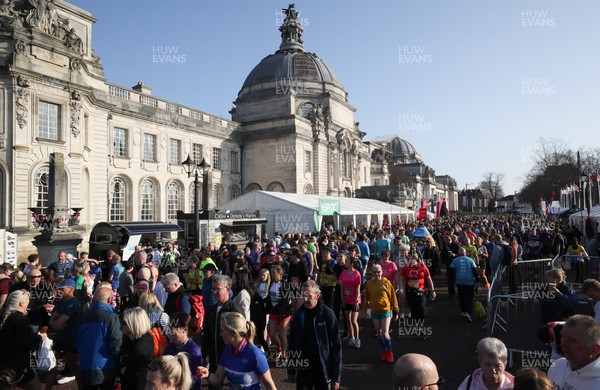 270322 - Cardiff University Cardiff Half Marathon - Participants gather at the various companies and charities in the runners village ahead of the start of the race