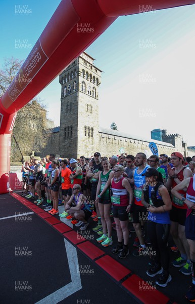 270322 - Cardiff University Cardiff Half Marathon - Runners gather at the start line outside Cardiff Castle ahead of the start of the race