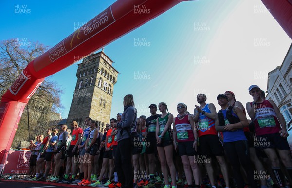 270322 - Cardiff University Cardiff Half Marathon - Runners gather at the start line outside Cardiff Castle ahead of the start of the race