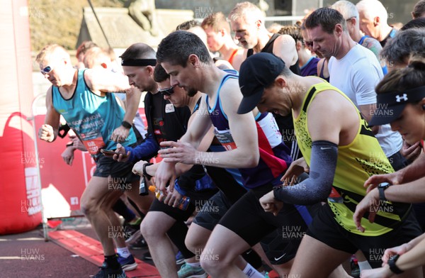 270322 - Cardiff University Cardiff Half Marathon - Runners head off at the start of the race