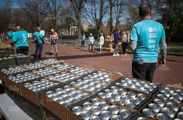270322 - Cardiff University Cardiff Half Marathon - Kombucha cans are handed out at the end of the race