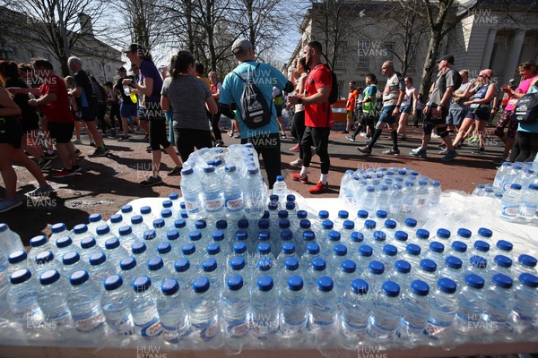 270322 - Cardiff University Cardiff Half Marathon - Brecon Carreg water is handed out at the end of the race