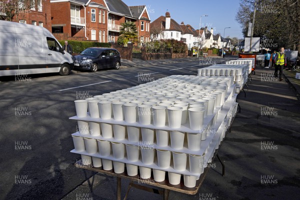 270322 - Cardiff University Cardiff Half Marathon - Volunteers prepare paper cups of water at Roath Park
