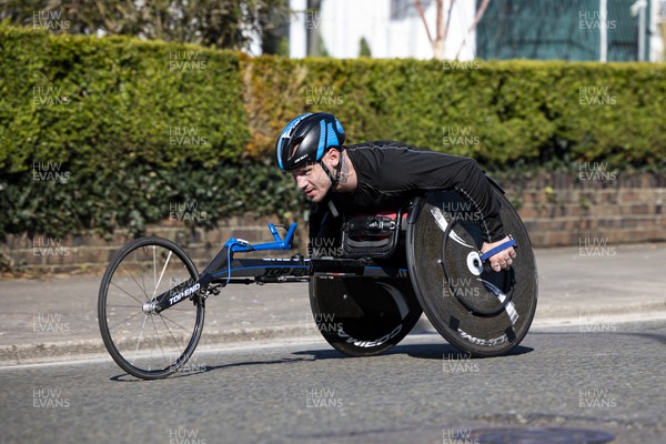 270322 - Cardiff University Cardiff Half Marathon - Leader of the wheelchair race Sam Kolek at Roath Park