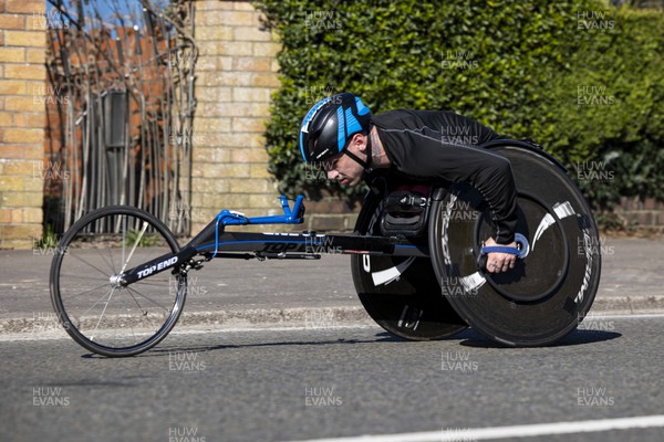 270322 - Cardiff University Cardiff Half Marathon - Leader of the wheelchair race Sam Kolek at Roath Park