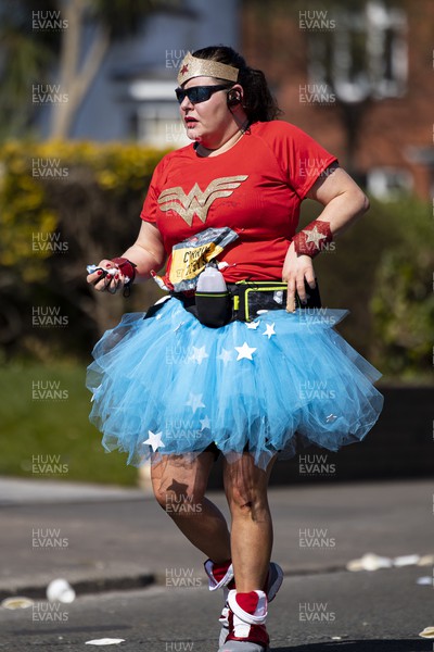 270322 - Cardiff University Cardiff Half Marathon - Runner in Wonder Woman costume at Roath Park