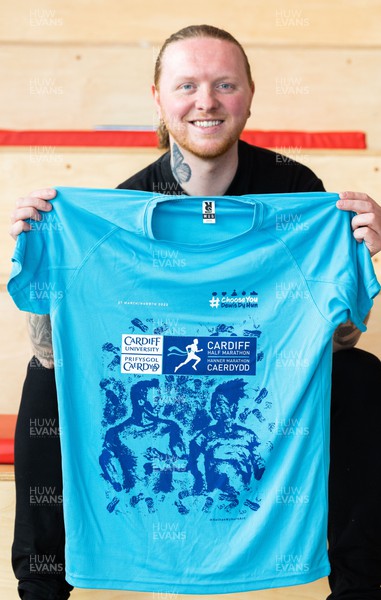 210322 Cardiff University Cardiff Half Marathon Event and Race T Shirt Reveal - Artist Nathan Wyburn with the artwork and finished race T shirt for the Cardiff University Cardiff Half Marathon