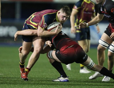 121218 - Cardiff Met v Cardiff University, BUCS Super League - Harry Seward of Cardiff Met is tackled