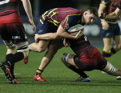 121218 - Cardiff Met v Cardiff University, BUCS Super League - Harry Seward of Cardiff Met is tackled