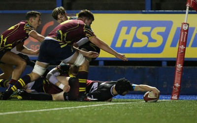 121218 - Cardiff Met v Cardiff University, BUCS Super League - Ioan Davies of Cardiff University reaches out to score try