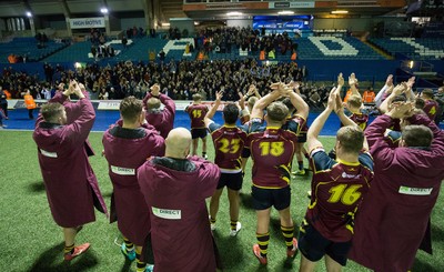 121218 - Cardiff Met v Cardiff University, BUCS Super League - Cardiff Met players celebrate with their supporters after beating Cardiff University