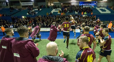 121218 - Cardiff Met v Cardiff University, BUCS Super League - Cardiff Met players celebrate with their supporters after beating Cardiff University