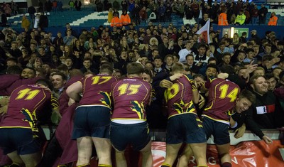 121218 - Cardiff Met v Cardiff University, BUCS Super League - Cardiff Met players celebrate with their supporters after beating Cardiff University