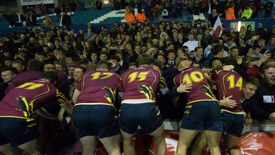 121218 - Cardiff Met v Cardiff University, BUCS Super League - Cardiff Met players celebrate with their supporters after beating Cardiff University