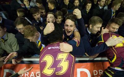 121218 - Cardiff Met v Cardiff University, BUCS Super League - Cardiff Met players celebrate with their supporters after beating Cardiff University