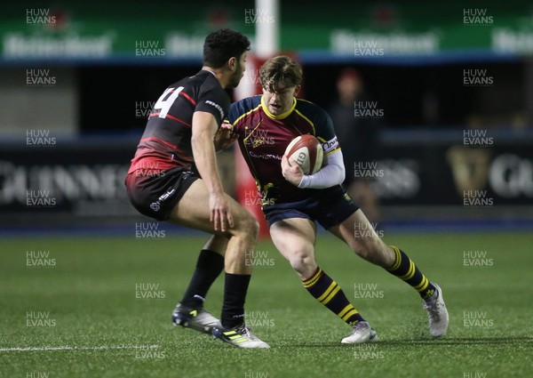 121218 - Cardiff Met v Cardiff University, BUCS Super League - Tom Benjamin of Cardiff Met is tackled by Adam Sadbri of Cardiff University