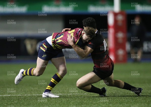 121218 - Cardiff Met v Cardiff University, BUCS Super League - Tom Benjamin of Cardiff Met is tackled by Adam Sadbri of Cardiff University