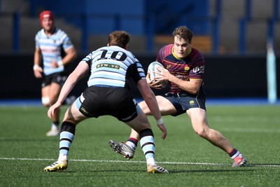230526 - Cardiff Met v Glamorgan Wanderers - Mallet Cup Final - Wyatt McLoughlin of Cardiff Met is challenged by Jacob Lloyd of Glamorgan Wanderers