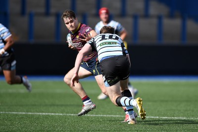 230526 - Cardiff Met v Glamorgan Wanderers - Mallet Cup Final - Wyatt McLoughlin of Cardiff Met is challenged by Jacob Lloyd of Glamorgan Wanderers