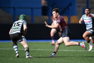 230526 - Cardiff Met v Glamorgan Wanderers - Mallet Cup Final - Wyatt McLoughlin of Cardiff Met is challenged by Ed Thomas of Glamorgan Wanderers