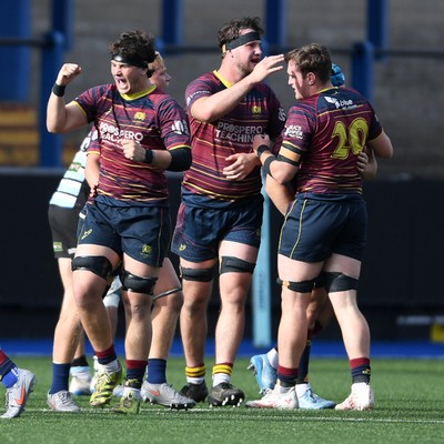 230526 - Cardiff Met v Glamorgan Wanderers - Mallet Cup Final - Cardiff Met players celebrate at full time after getting the win