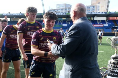 230526 - Cardiff Met v Glamorgan Wanderers - Mallet Cup Final - Cardiff met players collect their winners trophies at full time