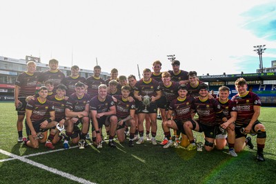 230526 - Cardiff Met v Glamorgan Wanderers - Mallet Cup Final - Cardiff met players celebrate lifting the Mallet cup at full time
