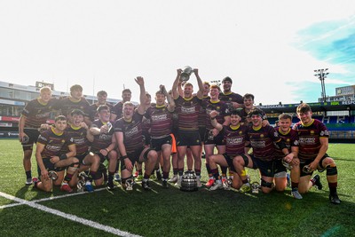 230526 - Cardiff Met v Glamorgan Wanderers - Mallet Cup Final - Cardiff met players celebrate lifting the Mallet cup at full time