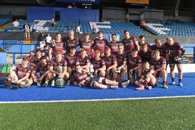 230526 - Cardiff Met v Glamorgan Wanderers - Mallet Cup Final - Cardiff met players celebrate lifting the Mallet cup at full time