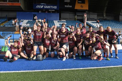 230526 - Cardiff Met v Glamorgan Wanderers - Mallet Cup Final - Cardiff met players celebrate lifting the Mallet cup at full time