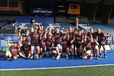 230526 - Cardiff Met v Glamorgan Wanderers - Mallet Cup Final - Cardiff met players celebrate lifting the Mallet cup at full time