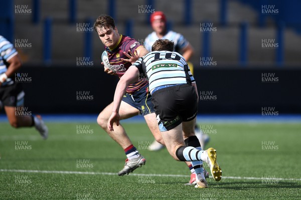 230526 - Cardiff Met v Glamorgan Wanderers - Mallet Cup Final - Wyatt McLoughlin of Cardiff Met is challenged by Jacob Lloyd of Glamorgan Wanderers