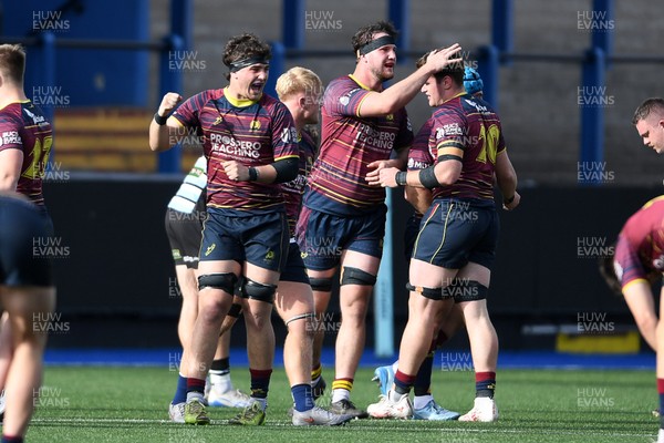 230526 - Cardiff Met v Glamorgan Wanderers - Mallet Cup Final - Cardiff Met players celebrate at full time after getting the win