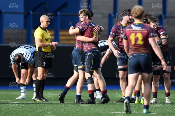 230526 - Cardiff Met v Glamorgan Wanderers - Mallet Cup Final - Cardiff Met players celebrate at full time after getting the win
