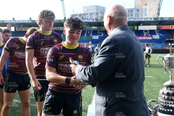 230526 - Cardiff Met v Glamorgan Wanderers - Mallet Cup Final - Cardiff met players collect their winners trophies at full time