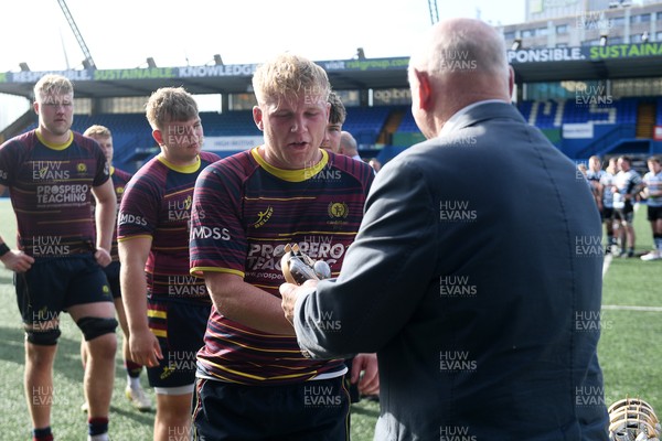 230526 - Cardiff Met v Glamorgan Wanderers - Mallet Cup Final - Cardiff met players collect their winners trophies at full time