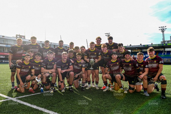 230526 - Cardiff Met v Glamorgan Wanderers - Mallet Cup Final - Cardiff met players celebrate lifting the Mallet cup at full time