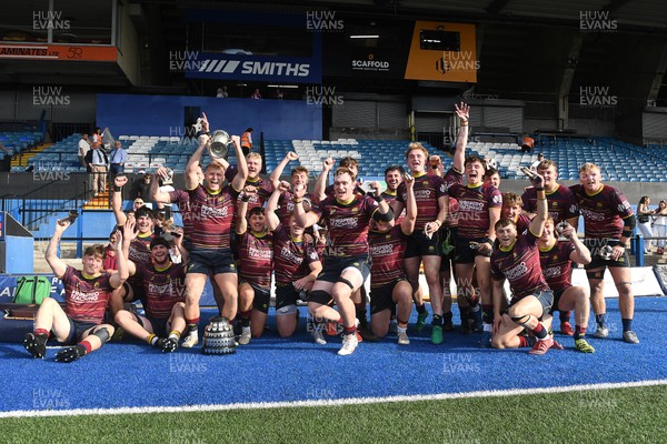 230526 - Cardiff Met v Glamorgan Wanderers - Mallet Cup Final - Cardiff met players celebrate lifting the Mallet cup at full time