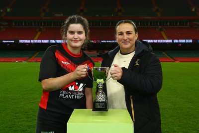 061225 - Cardiff Quins v Gwylliad Meirionnydd - WRU Girls U18 Hub Final - Captain of Gwylliad Meirionnydd Efa Thorp receives the trophy from Siwan Lillicrap of WRU