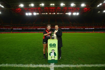 061225 - Cardiff Quins v Gwylliad Meirionnydd - WRU Girls U18 Hub Final - Captain of Gwylliad Meirionnydd Efa Thorp receives the trophy from Siwan Lillicrap of WRU