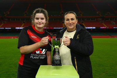 061225 - Cardiff Quins v Gwylliad Meirionnydd - WRU Girls U18 Hub Final - Captain of Gwylliad Meirionnydd Efa Thorp receives the trophy from Siwan Lillicrap of WRU